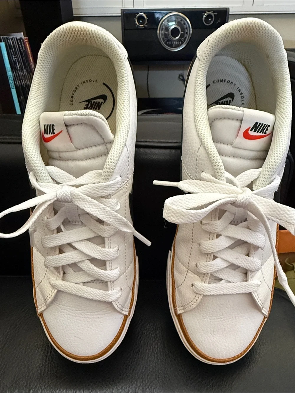 Nike White Low-Top Sneakers with Black Swoosh and Brown Trim